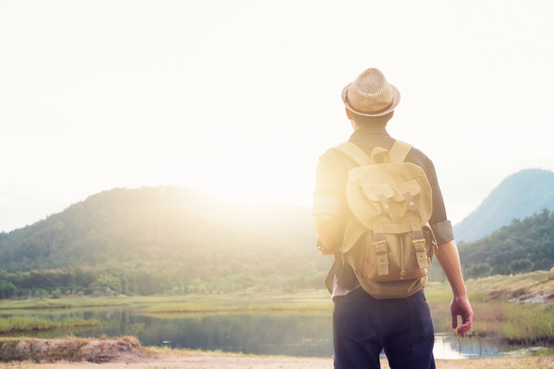 Young Man Traveler with backpack relaxing outdoor. (Image by freepik )
