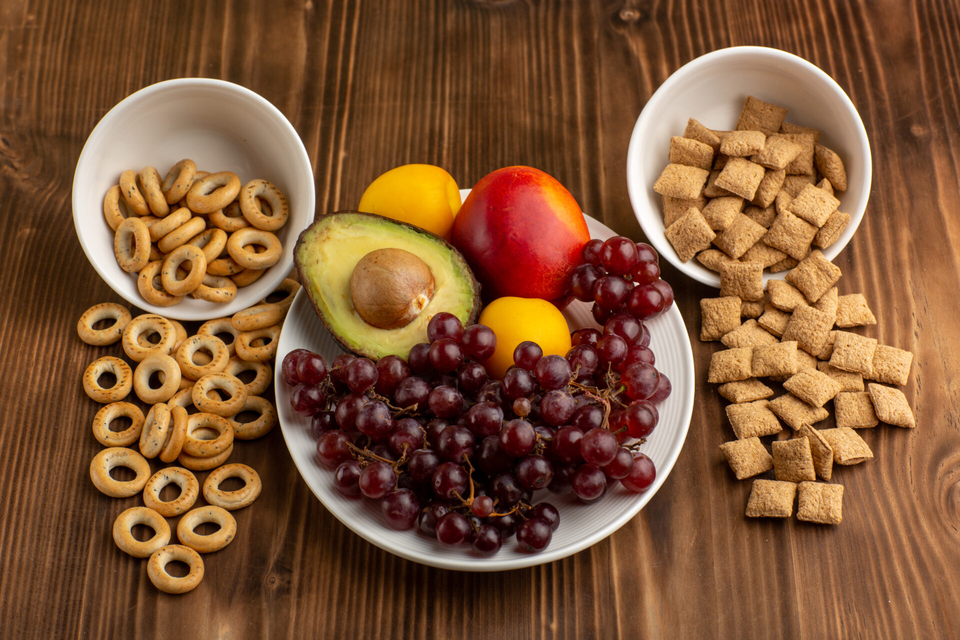 front-view-little-cookies-crackers-with-fruits-brown-wooden-desk(Image by freepik )